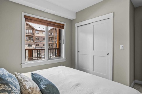 200-707 Spring Creek Drive, Canmore, AB - Indoor Photo Showing Bedroom