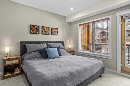 200-707 Spring Creek Drive, Canmore, AB - Indoor Photo Showing Bedroom