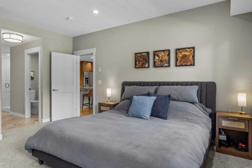 200-707 Spring Creek Drive, Canmore, AB - Indoor Photo Showing Bedroom