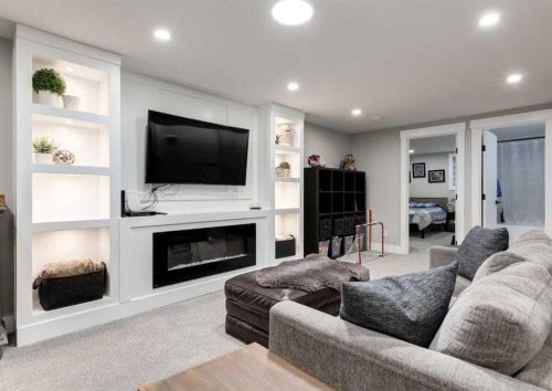 4627 Verona Drive Nw, Calgary, AB - Indoor Photo Showing Living Room With Fireplace
