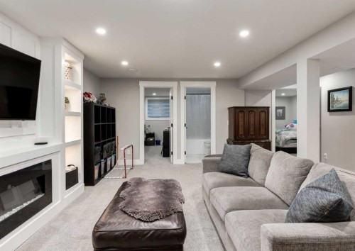 4627 Verona Drive Nw, Calgary, AB - Indoor Photo Showing Living Room With Fireplace
