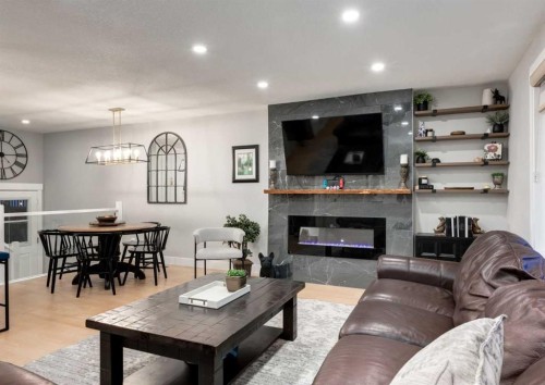 4627 Verona Drive Nw, Calgary, AB - Indoor Photo Showing Living Room With Fireplace