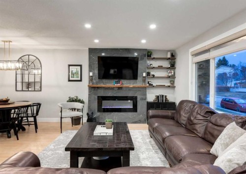 4627 Verona Drive Nw, Calgary, AB - Indoor Photo Showing Living Room With Fireplace