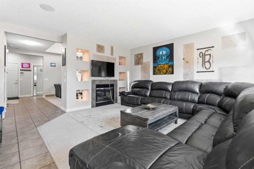 19 Saddleland Drive, Calgary, AB - Indoor Photo Showing Living Room With Fireplace