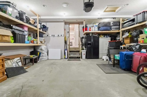 19 Saddleland Drive, Calgary, AB - Indoor Photo Showing Garage