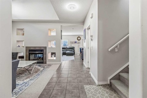 19 Saddleland Drive, Calgary, AB - Indoor Photo Showing Other Room With Fireplace