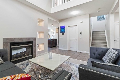 19 Saddleland Drive, Calgary, AB - Indoor Photo Showing Living Room With Fireplace
