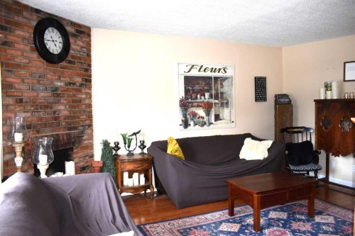6348 Bowmont Crescent Nw, Calgary, AB - Indoor Photo Showing Living Room With Fireplace
