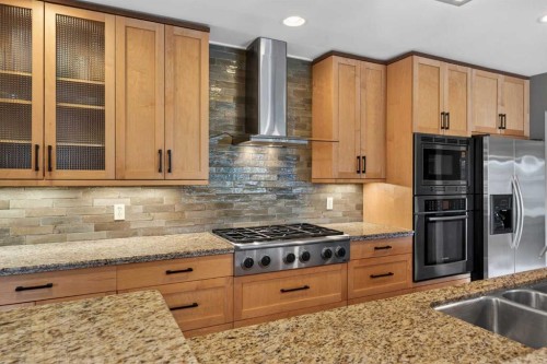 31 Rosetree Road Nw, Calgary, AB - Indoor Photo Showing Kitchen With Double Sink With Upgraded Kitchen