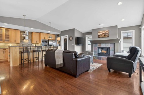 31 Rosetree Road Nw, Calgary, AB - Indoor Photo Showing Living Room With Fireplace