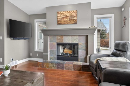 31 Rosetree Road Nw, Calgary, AB - Indoor Photo Showing Living Room With Fireplace