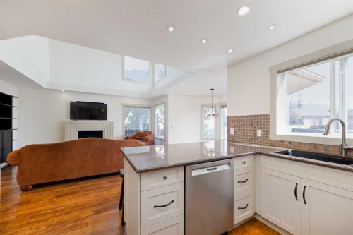 203 Cambridge Bay, Strathmore, AB - Indoor Photo Showing Kitchen With Fireplace
