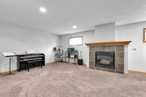 132 West Creek Drive, Chestermere, AB - Indoor Photo Showing Living Room With Fireplace