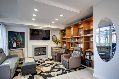 231-222 Riverfront Avenue Sw, Calgary, AB - Indoor Photo Showing Other Room With Fireplace