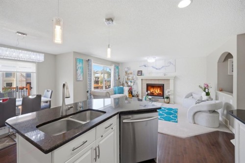 87 Kincora Drive Nw, Calgary, AB - Indoor Photo Showing Other Room With Fireplace