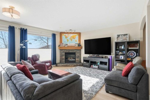 40 Eagleview Way, Cochrane, AB - Indoor Photo Showing Living Room With Fireplace
