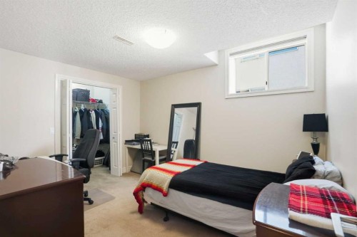 40 Eagleview Way, Cochrane, AB - Indoor Photo Showing Bedroom