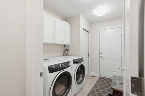 40 Eagleview Way, Cochrane, AB - Indoor Photo Showing Laundry Room
