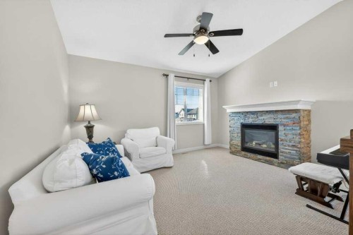 200 Kingston Way Se, Airdrie, AB - Indoor Photo Showing Living Room With Fireplace