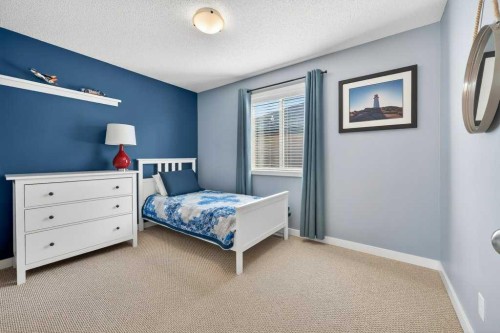 200 Kingston Way Se, Airdrie, AB - Indoor Photo Showing Bedroom