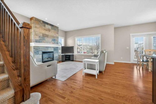 200 Kingston Way Se, Airdrie, AB - Indoor Photo Showing Living Room With Fireplace