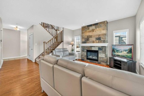 200 Kingston Way Se, Airdrie, AB - Indoor Photo Showing Living Room With Fireplace