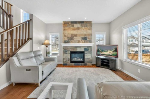 200 Kingston Way Se, Airdrie, AB - Indoor Photo Showing Living Room With Fireplace