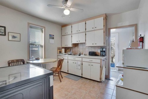 231 11A Street Ne, Calgary, AB - Indoor Photo Showing Kitchen With Double Sink
