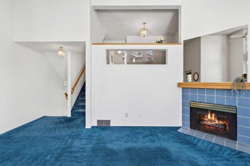 404 Hawkstone Manor Nw, Calgary, AB - Indoor With Fireplace