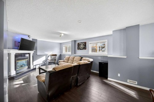 1503 Thorburn Drive Se, Airdrie, AB - Indoor With Fireplace