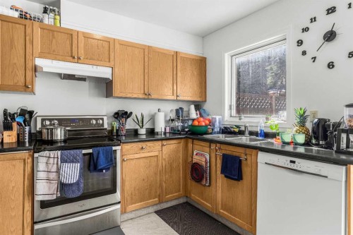 118 Glacier Drive, Banff, AB - Indoor Photo Showing Kitchen With Double Sink