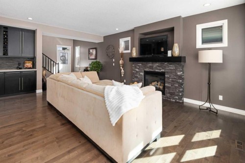 323 Nolan Hill Boulevard Nw, Calgary, AB - Indoor Photo Showing Living Room With Fireplace