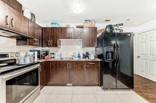46 Saddlecrest Gardens Ne, Calgary, AB - Indoor Photo Showing Kitchen With Double Sink