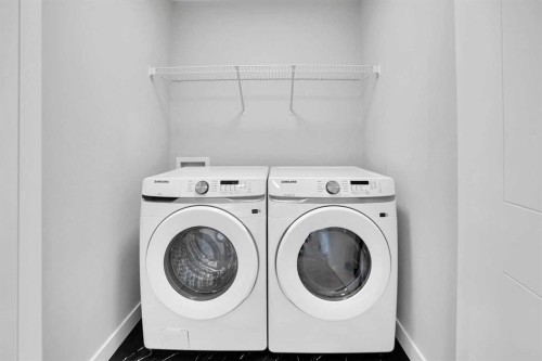 144 Cobblestone Gate Sw, Airdrie, AB - Indoor Photo Showing Laundry Room