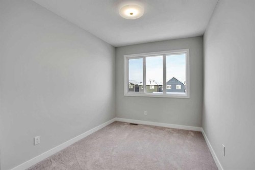 144 Cobblestone Gate Sw, Airdrie, AB - Indoor Photo Showing Other Room