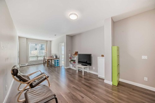 109-823 5 Avenue Nw, Calgary, AB - Indoor Photo Showing Living Room