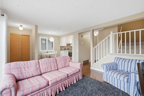 52A Millcrest Green Sw, Calgary, AB - Indoor Photo Showing Living Room