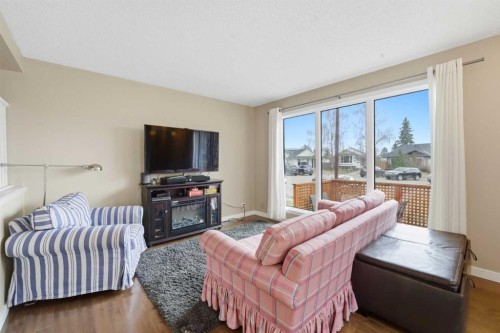 52A Millcrest Green Sw, Calgary, AB - Indoor Photo Showing Living Room