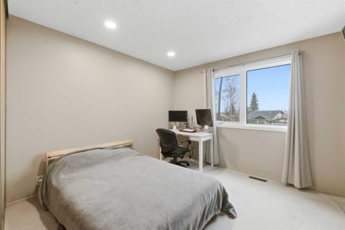 52A Millcrest Green Sw, Calgary, AB - Indoor Photo Showing Bedroom