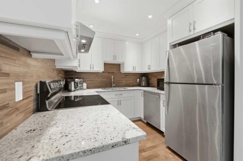 52A Millcrest Green Sw, Calgary, AB - Indoor Photo Showing Kitchen With Stainless Steel Kitchen