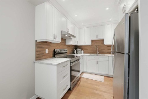 52A Millcrest Green Sw, Calgary, AB - Indoor Photo Showing Kitchen With Stainless Steel Kitchen With Upgraded Kitchen