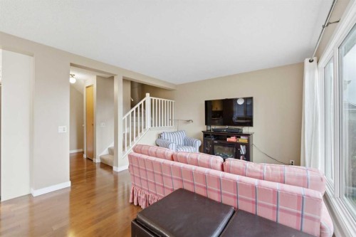 52A Millcrest Green Sw, Calgary, AB - Indoor Photo Showing Living Room