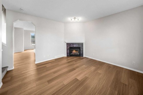 99 Covemeadow Close Ne, Calgary, AB - Indoor Photo Showing Living Room With Fireplace