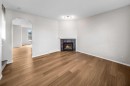 99 Covemeadow Close Ne, Calgary, AB  - Indoor Photo Showing Living Room With Fireplace 