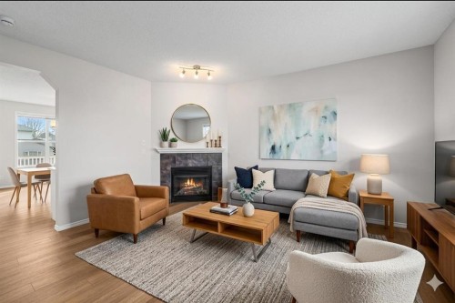 99 Covemeadow Close Ne, Calgary, AB - Indoor Photo Showing Living Room With Fireplace