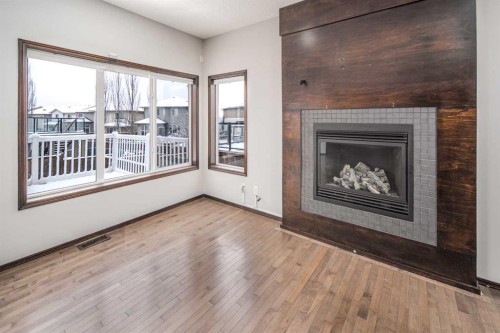 47 Pantego Avenue Nw, Calgary, AB - Indoor Photo Showing Living Room With Fireplace