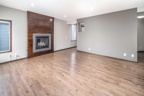 47 Pantego Avenue Nw, Calgary, AB - Indoor Photo Showing Other Room With Fireplace