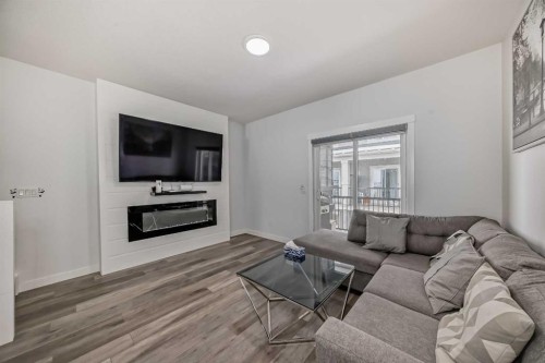 516-95 Skyview Close Ne, Calgary, AB - Indoor Photo Showing Living Room With Fireplace