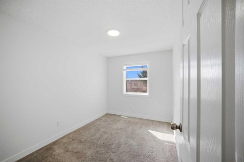 24 Martindale Drive Ne, Calgary, AB - Indoor Photo Showing Other Room