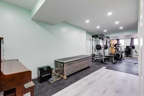24 Elgin Meadows Manor Se, Calgary, AB - Indoor Photo Showing Gym Room